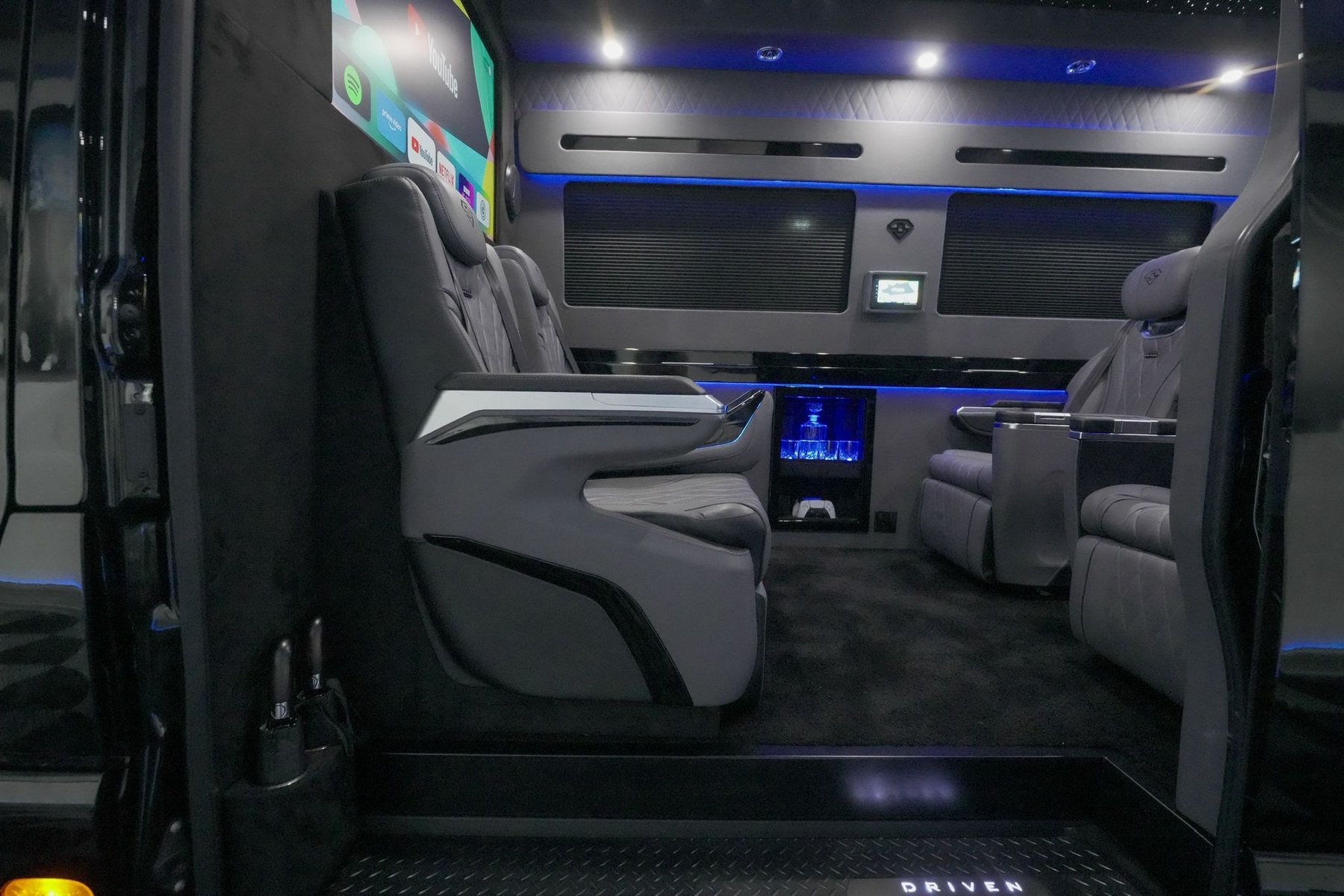 Executive cabin with reclining captain seats and ambient lighting