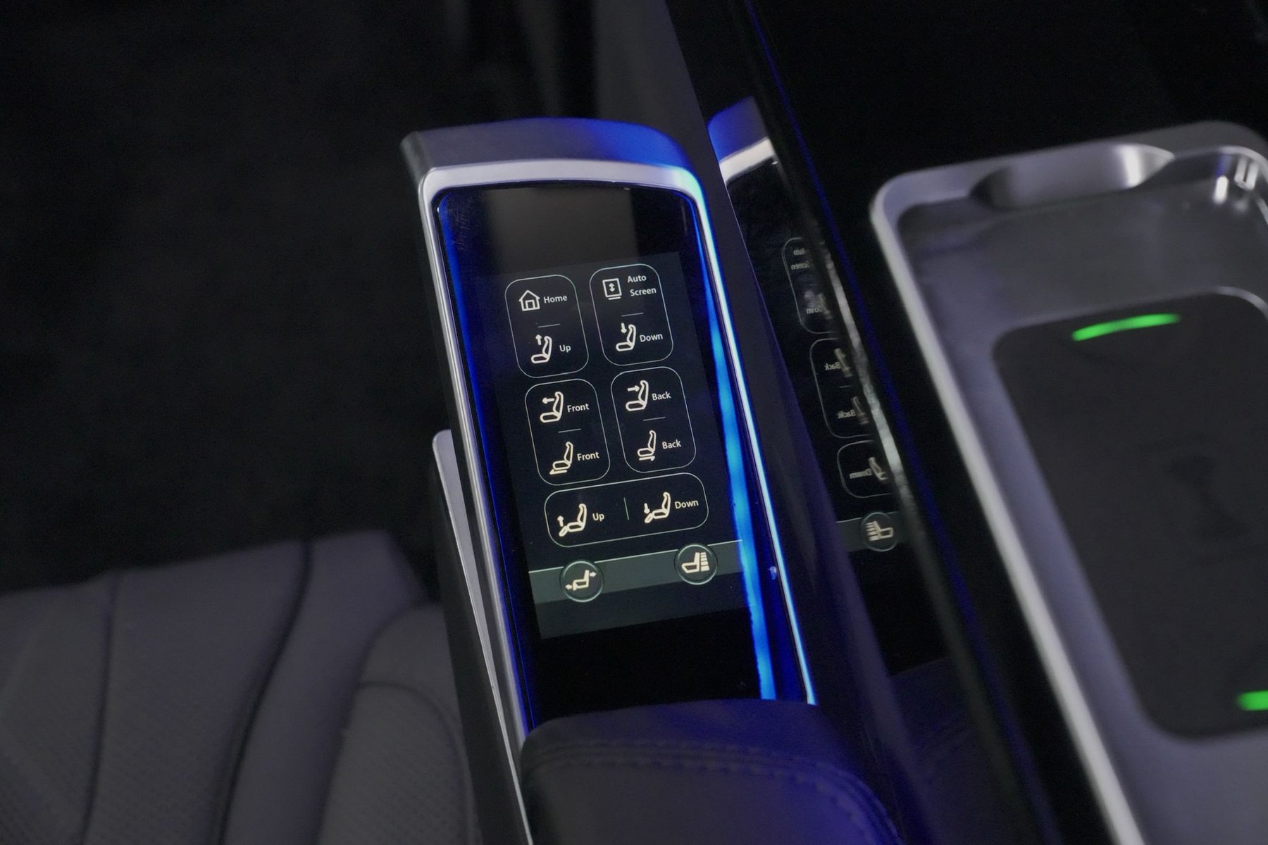 Touchscreen seat controls and wireless charging pad